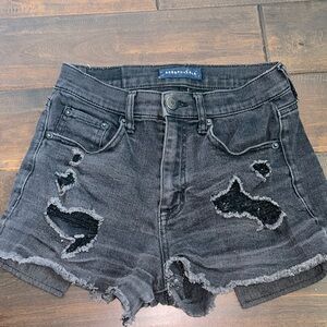 black ripped jean shorts